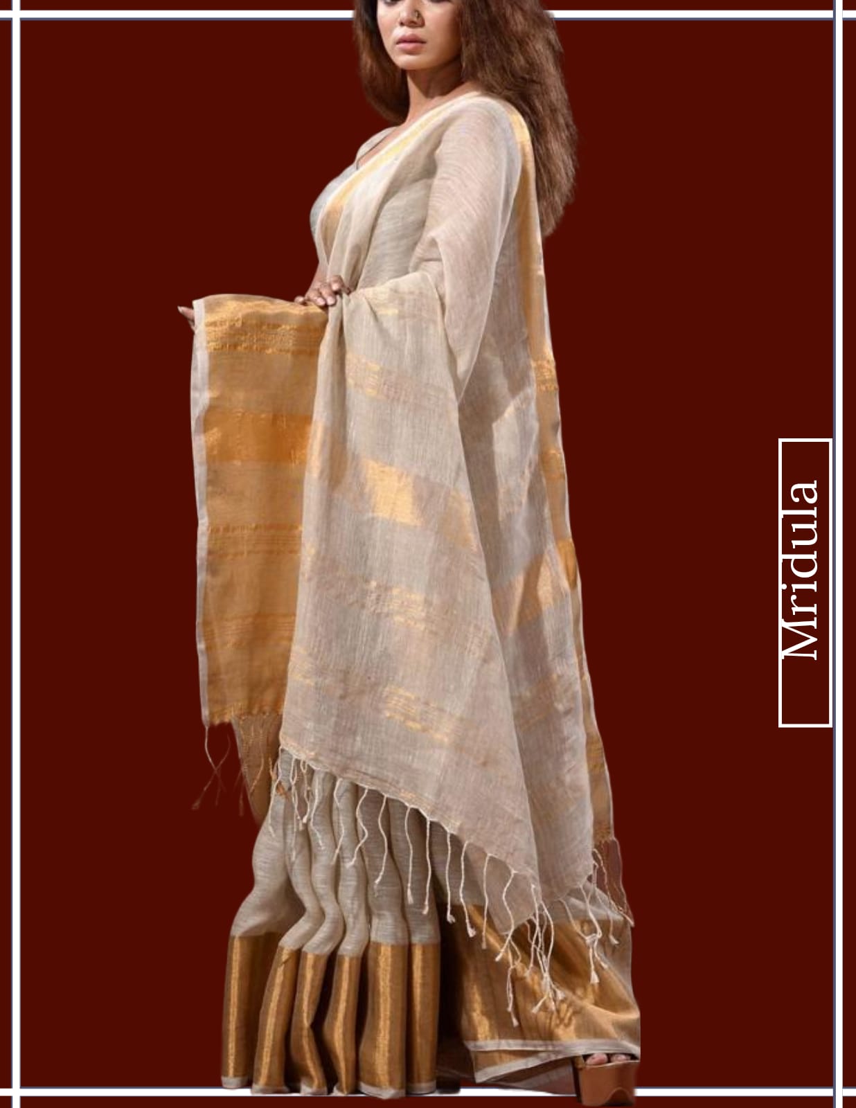 Model wearing pure linen Kerala saree with golden zari pallu and tassels by Mridula