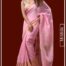 Model wearing Mridula blush pink pure linen Kasavu saree with golden zari border