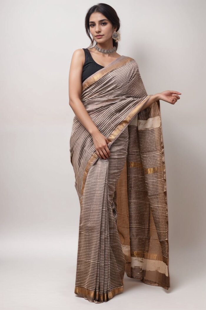 Woman in brown striped Maheshwari silk saree with golden border