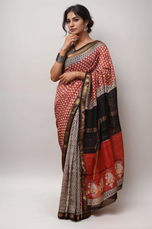 Woman wearing Maheshwari saree in red and black silk with golden zari border