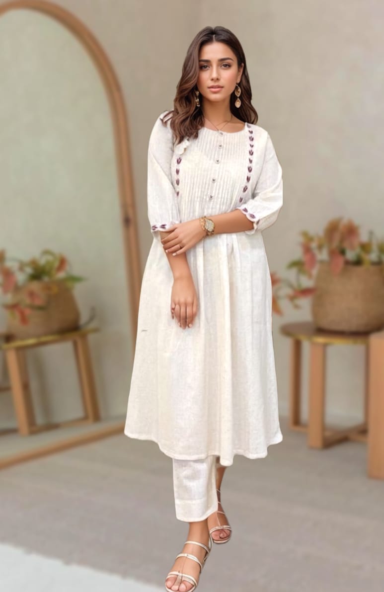 Model wearing an off-white cotton kurta set with embroidered detailing