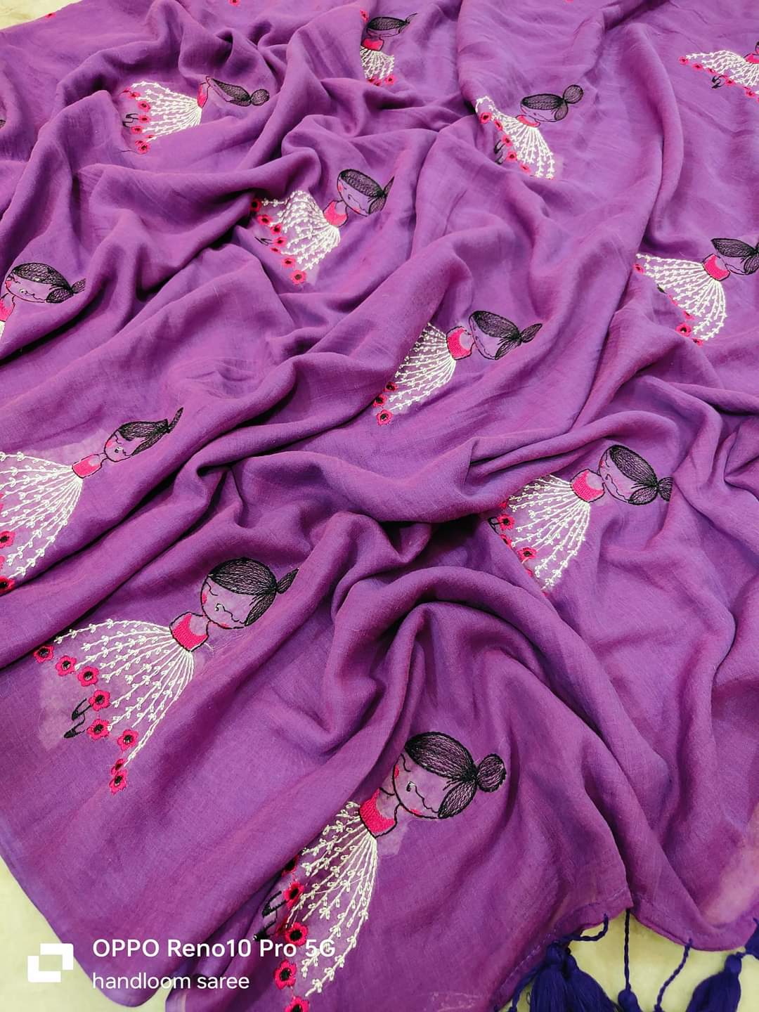 Purple mul cotton saree with handcrafted doll embroidery and delicate floral accents